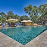 modern rectangular pool with grey slate tiles surrounding