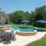 outdoor living area in texas countryside with swimming pool and trees