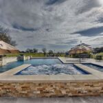 hot tub and jacuzzi jets in rectangle swimming pool in texas countryside