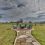 outdoor sitting area and firepit amidst brenham texas countryside